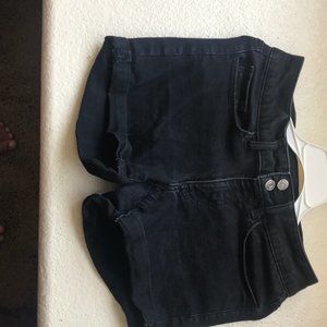 adorable black jean shorts that have 2 buttons